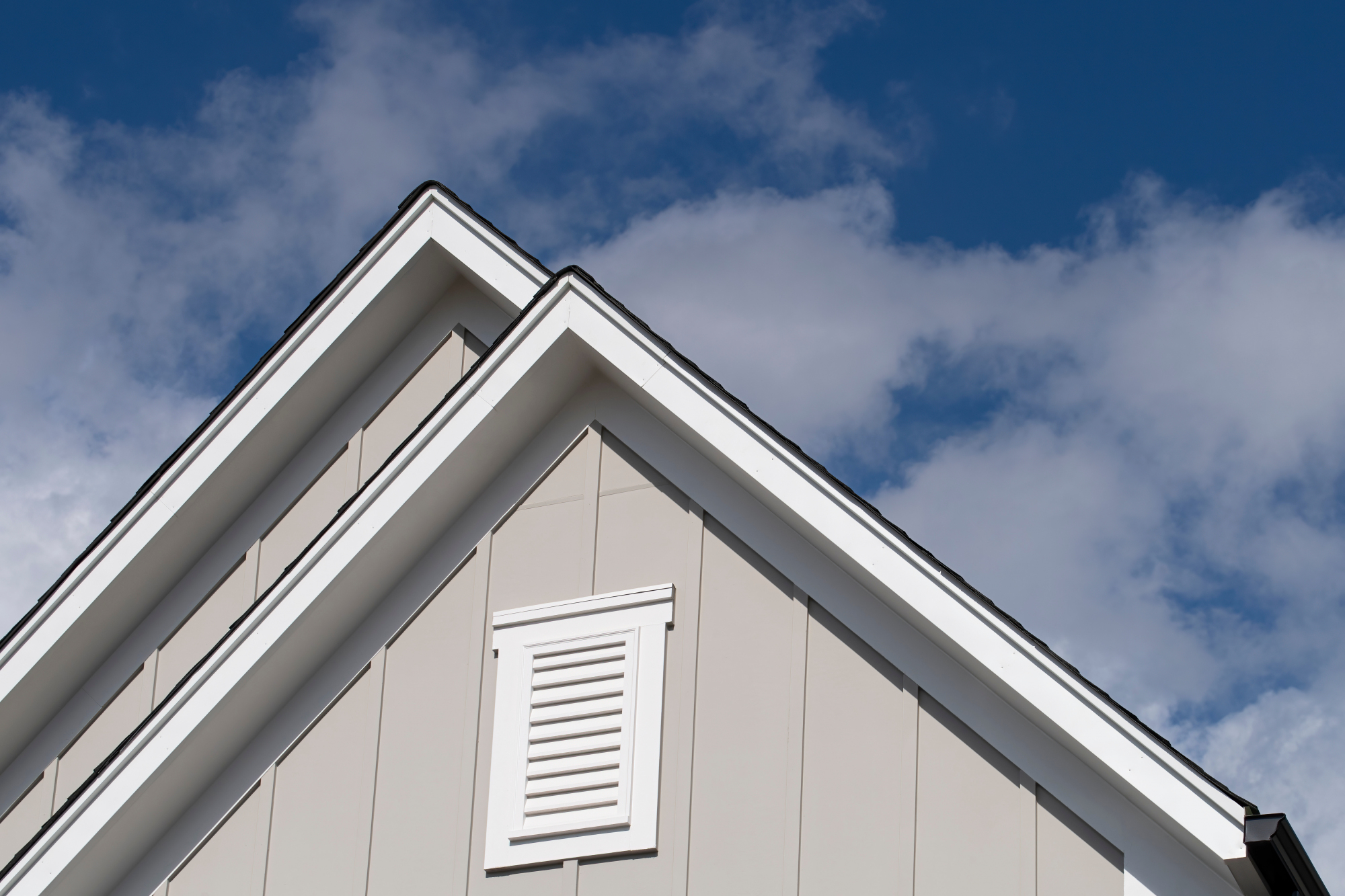 House roof with large vent on the front gable end
